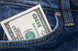 100 dollar bill tucked into jean pocket