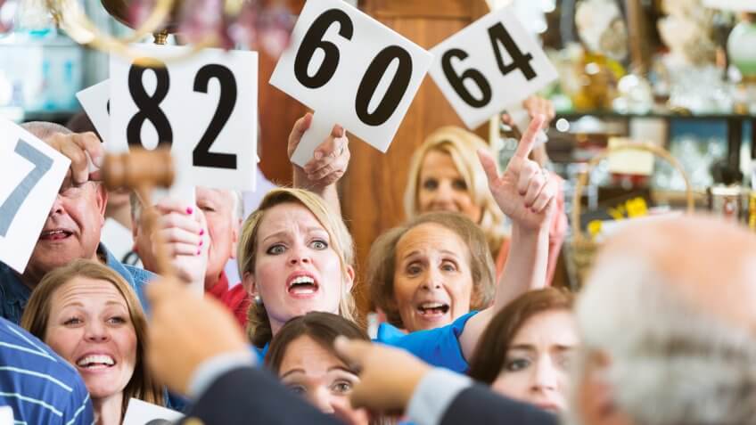 A crowd of bidders at Sheriff Sale auction.