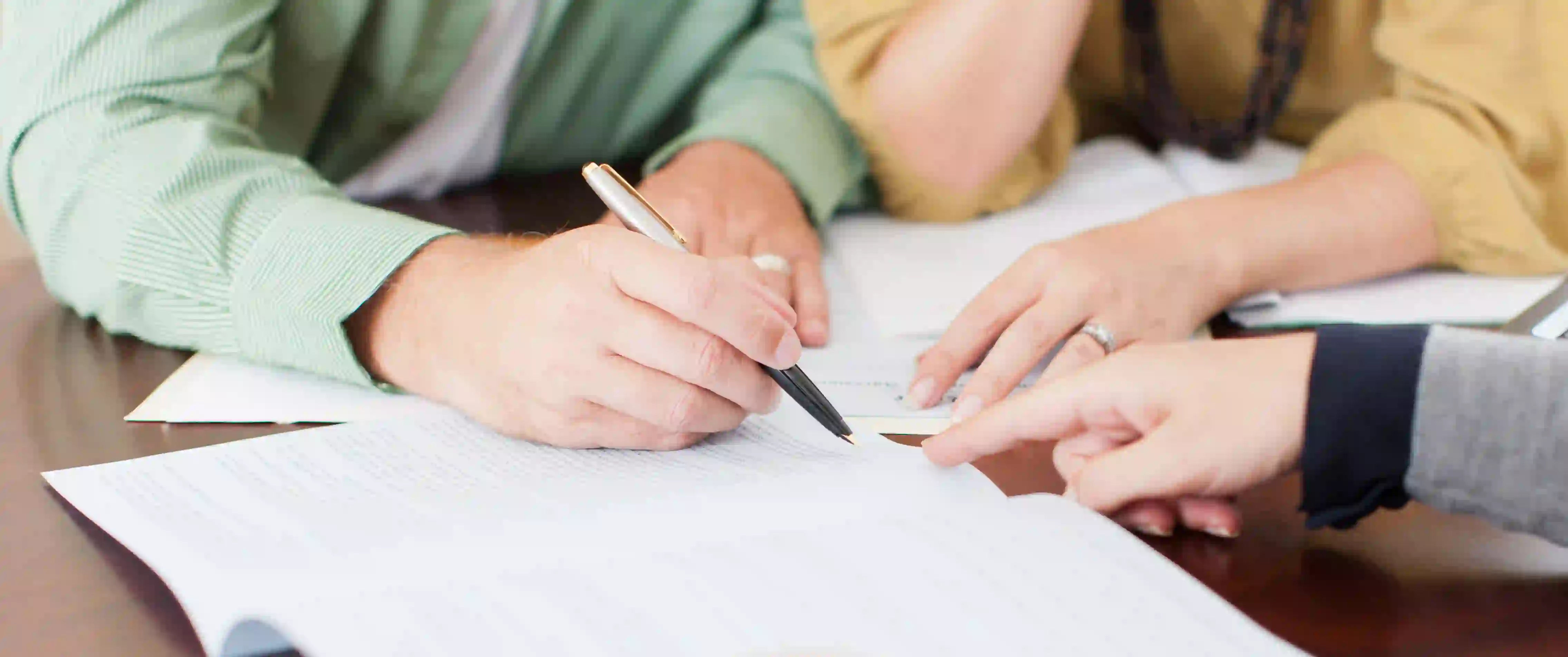 Couple signing contract.