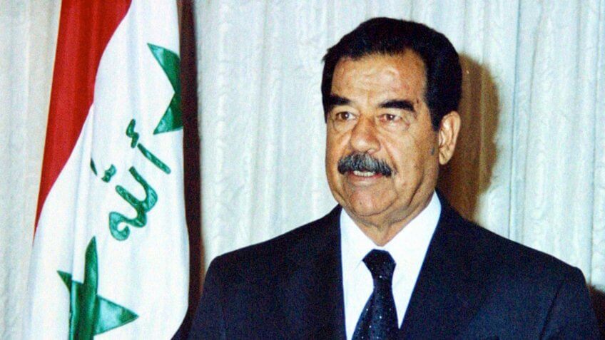 BAGHDAD, IRAQ - JULY 17: Iraqi President Saddam Hussein speaks marking the 34th anniversary of Iraq's revolution which brought the Baath Party to power July 17, 2002 in Baghdad, Iraq.