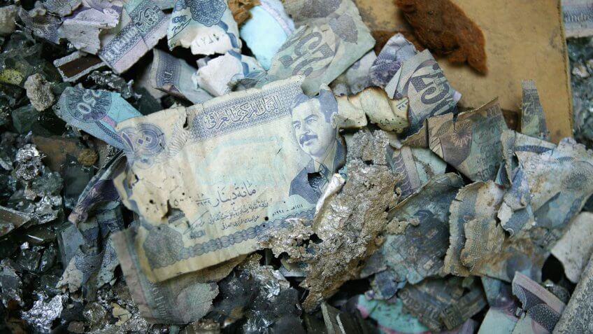 BAGHDAD, IRAQ - JUNE 2: Iraqi dinars lay on the floor of the Central Bank of Iraq June 2, 2004 in Baghdad, Iraq.