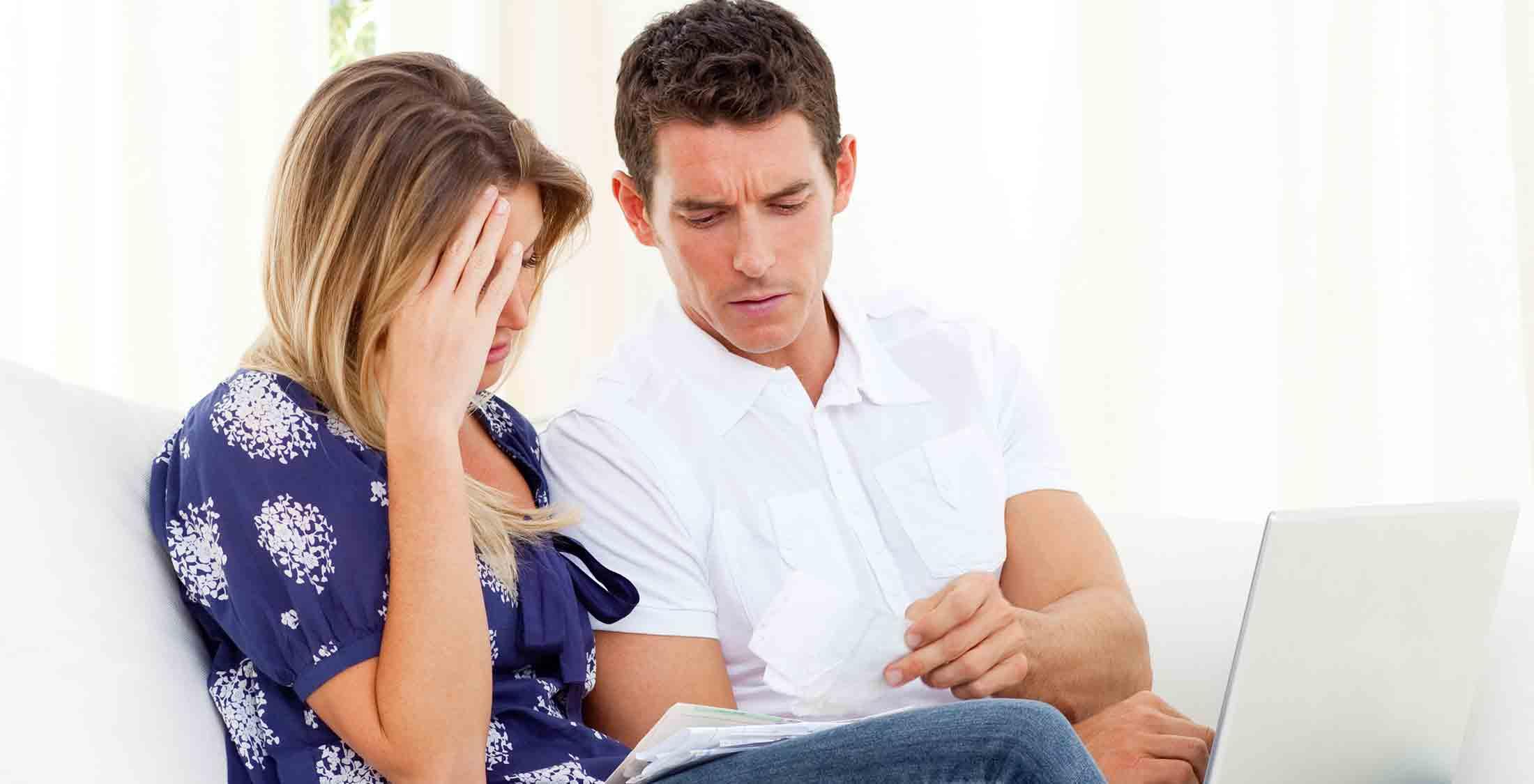 frustrated couple paperwork mortgage loan
