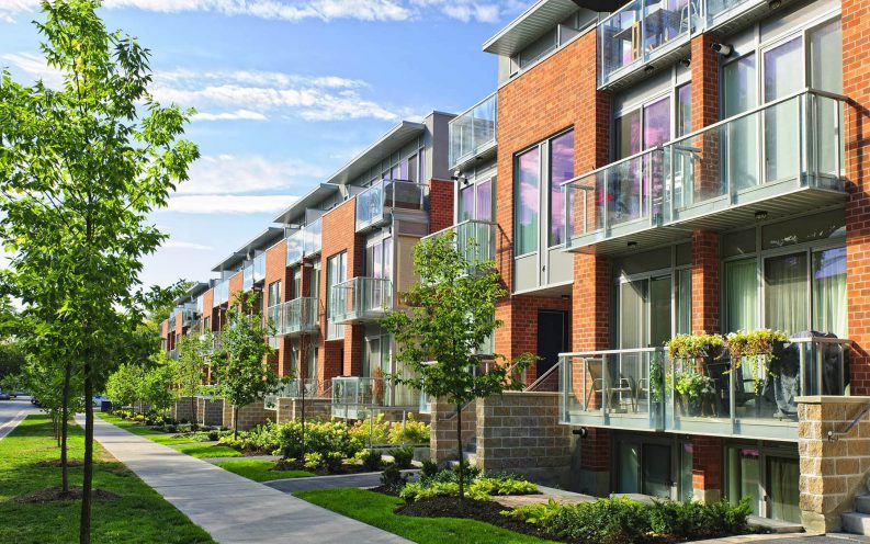 row of new apartments town home grass row of new apartments town home grass