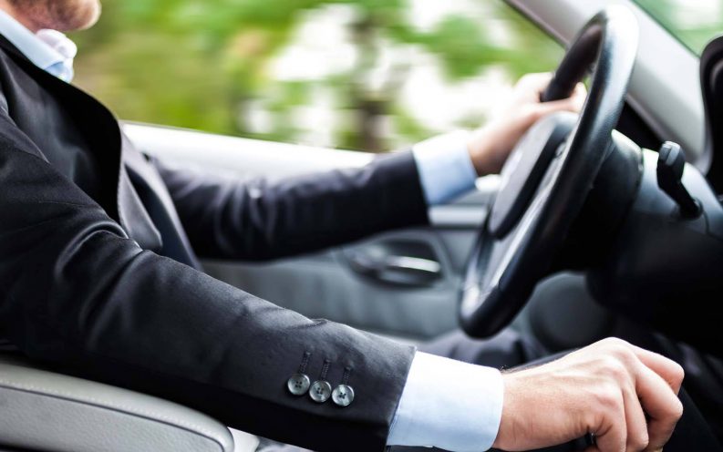 man suit driving car fast man suit driving car fast