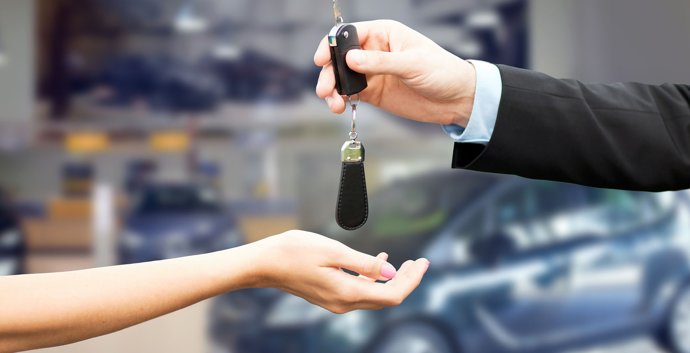 Credit insurance protection woman getting keys to new car
