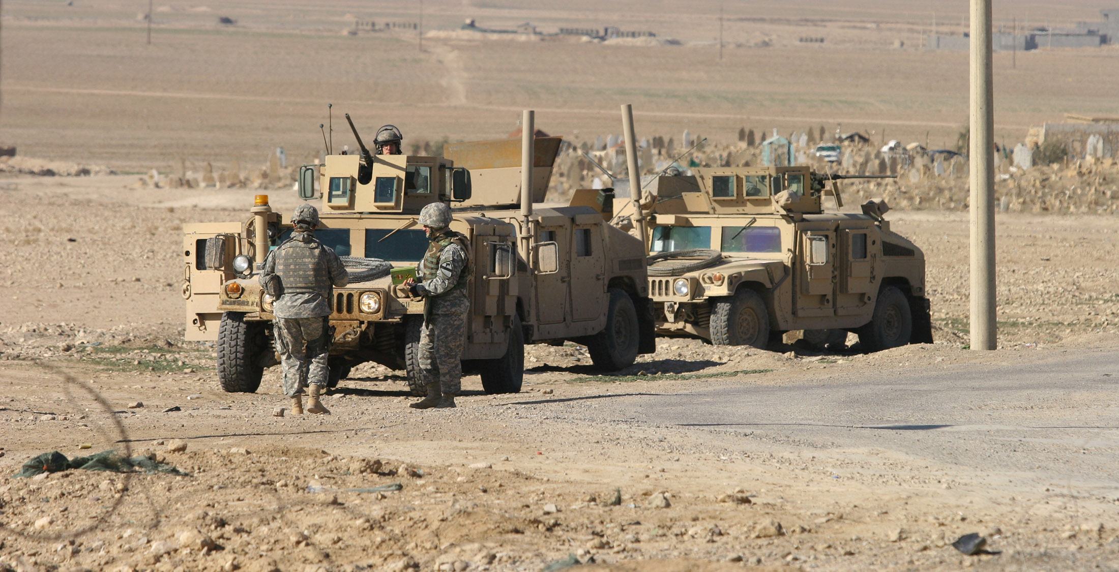 Cost of War on Terror. military vehicles and army men