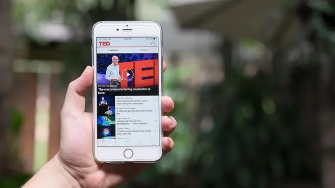 CHIANGMAI,THAILAND - NOV 02,2016 : A hand holding Apple iPhone 6 plus with shows details of TED app main page.