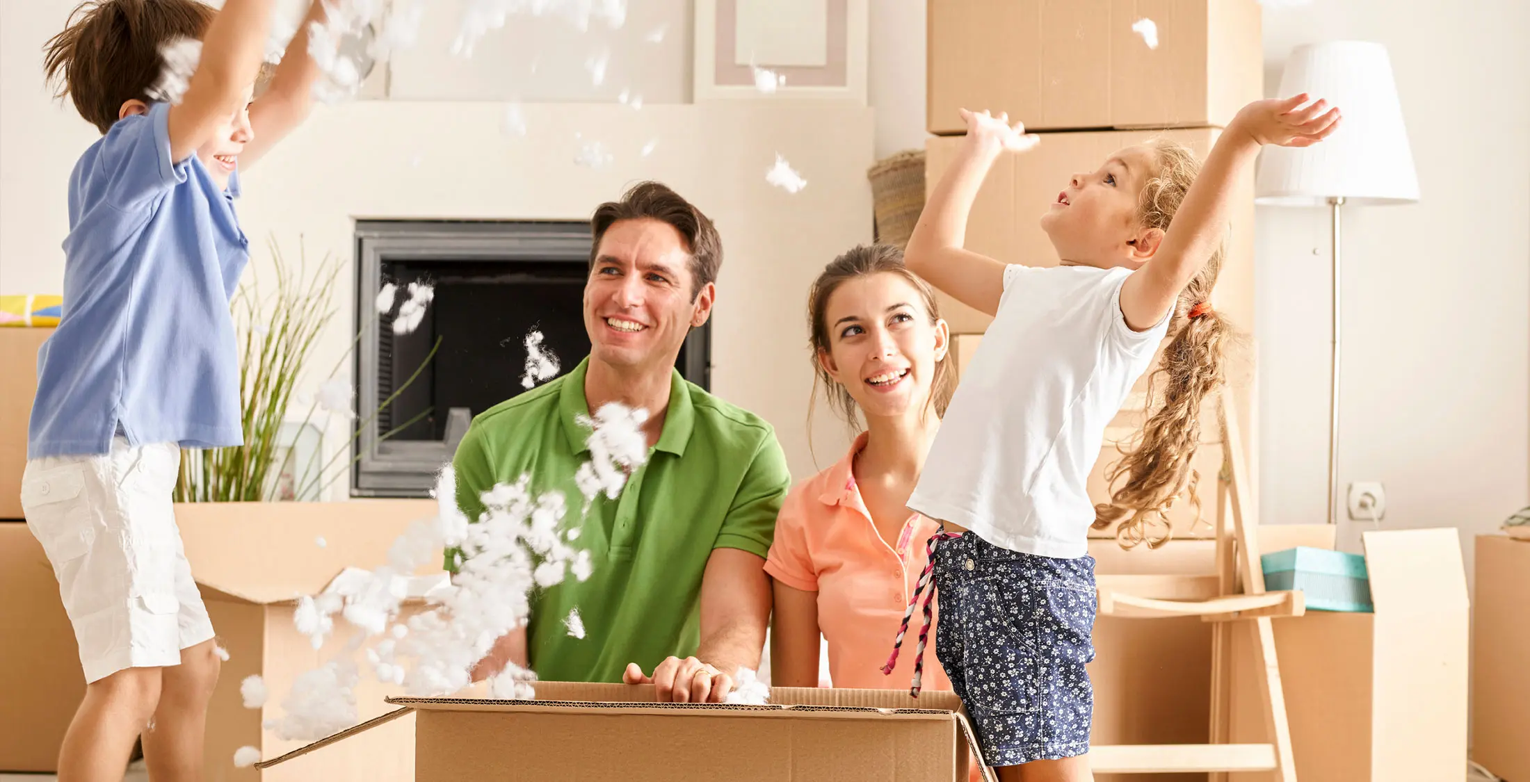 family moving fun kids unpack boxes