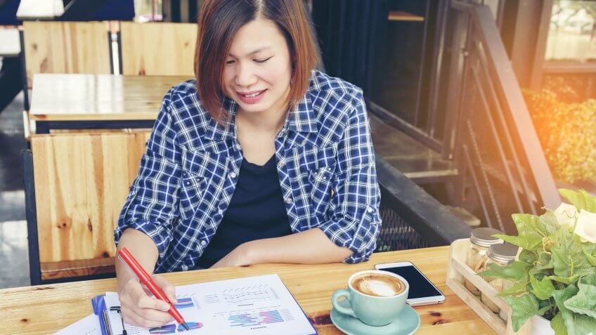 young woman working on her budget