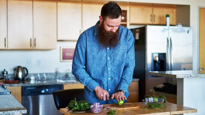 young man cooking in the kitchen