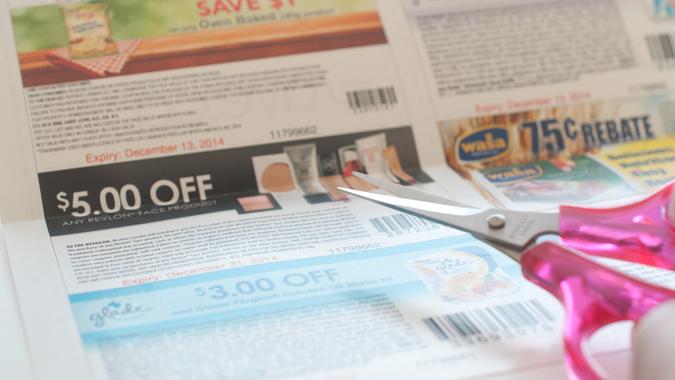 Coquitlam, BC Canada - November 11, 2014 : Woman prepare to cut coupon.