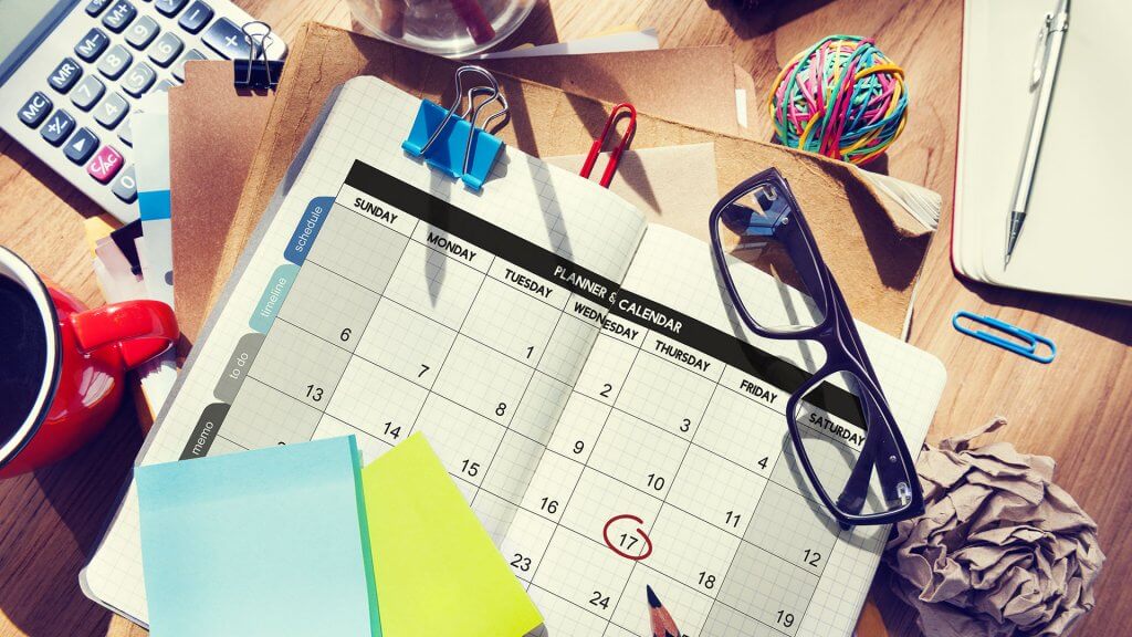 Calendars and Planners Overhead shot of planner open on desk