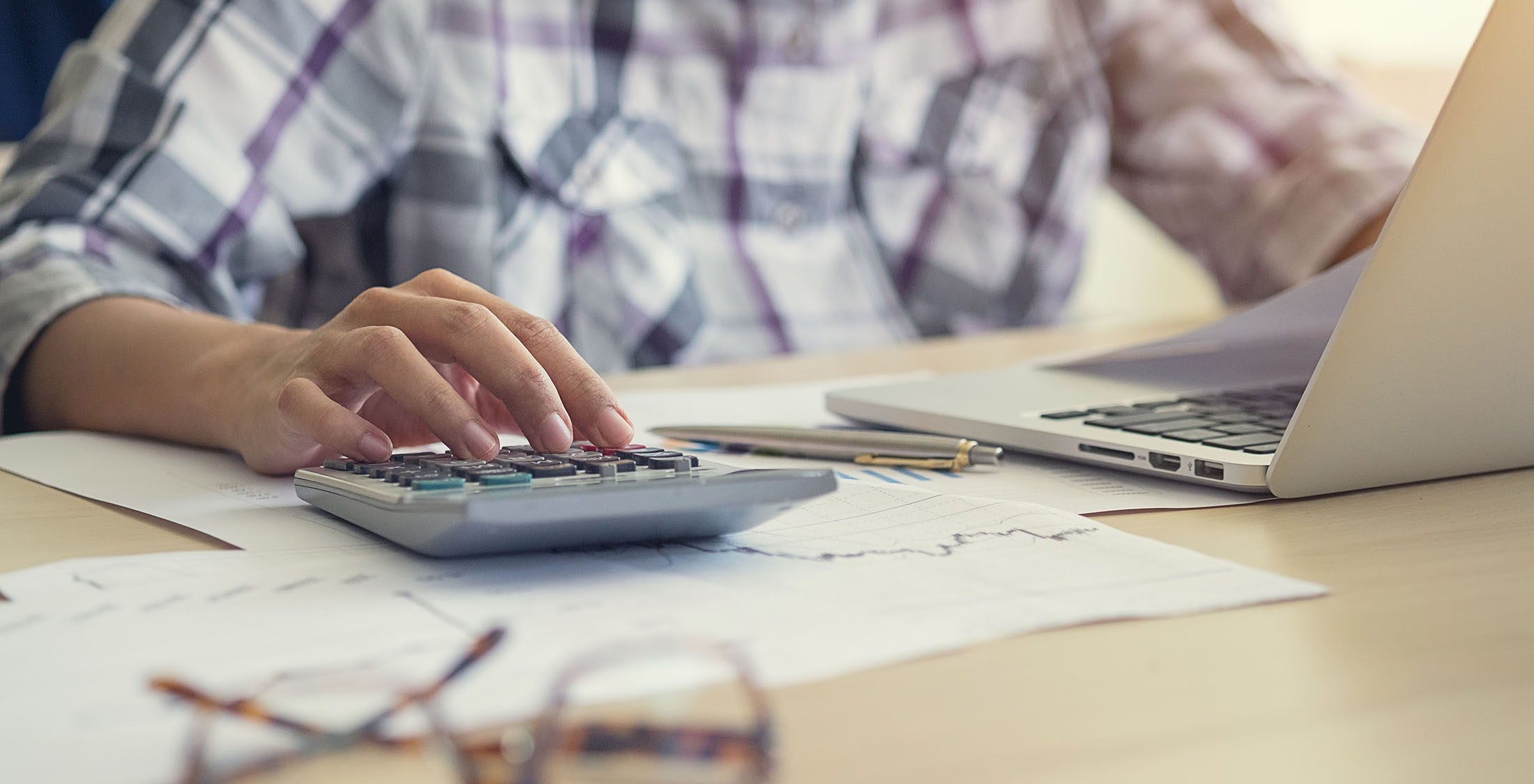 Refinance your mortgage person making calculations at desk