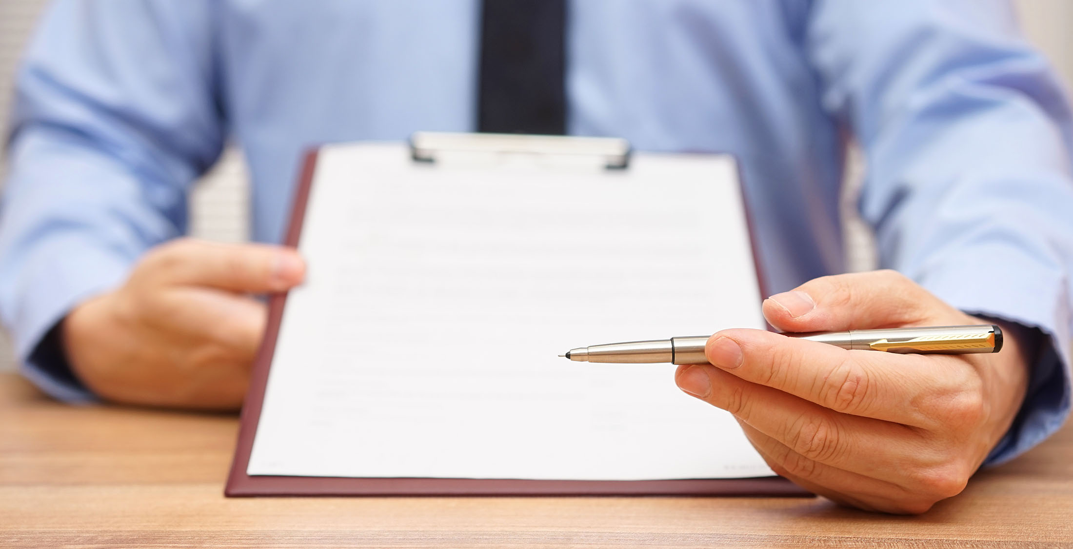Consider a reverse mortgage person holding out paper for signature