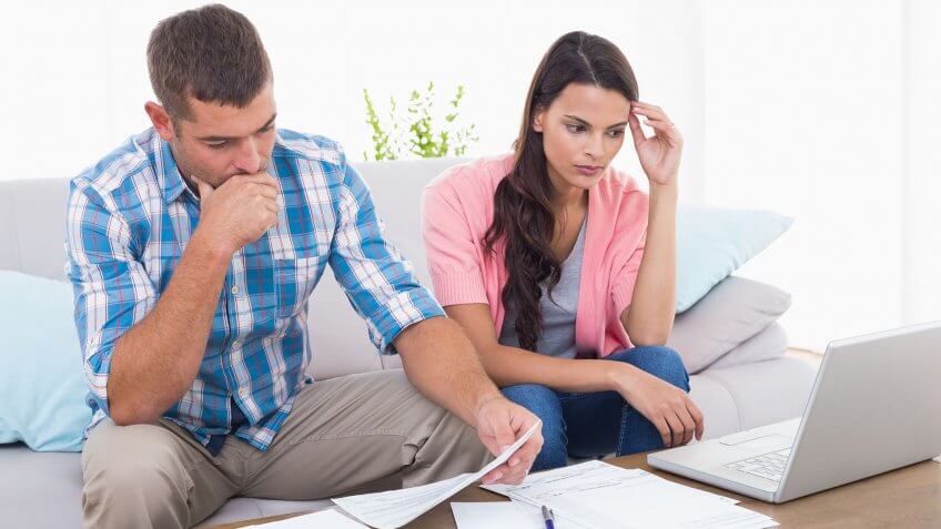 stressed couple going over finances