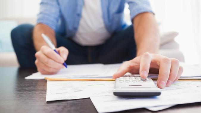 man calculating his finances