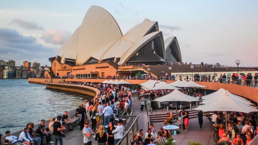 Australia on 18 September 2012 .It was designed by Danish archit, How Much to Tip When Traveling to These 25 Countries, SYDNEY-SEPTEMBER 18 : Party people at Sydney opera house in Sydn