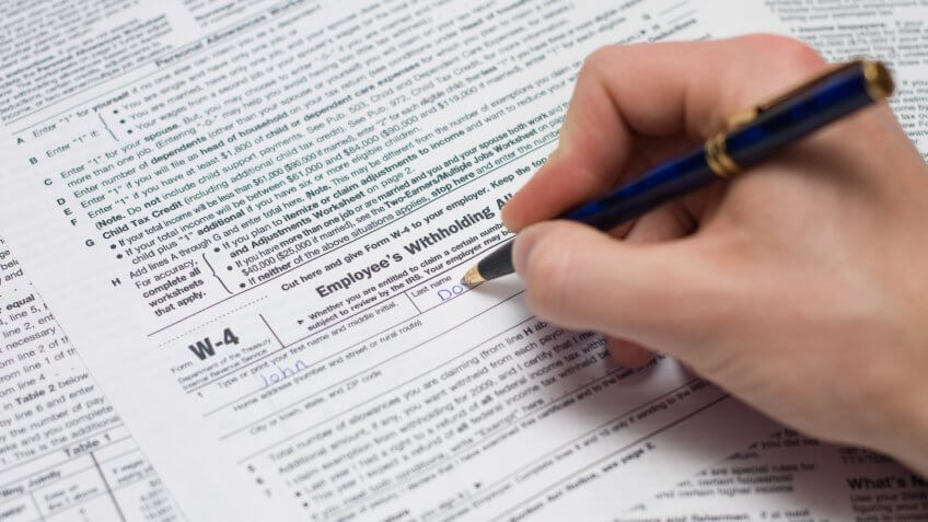 Filling out the W-4 form.