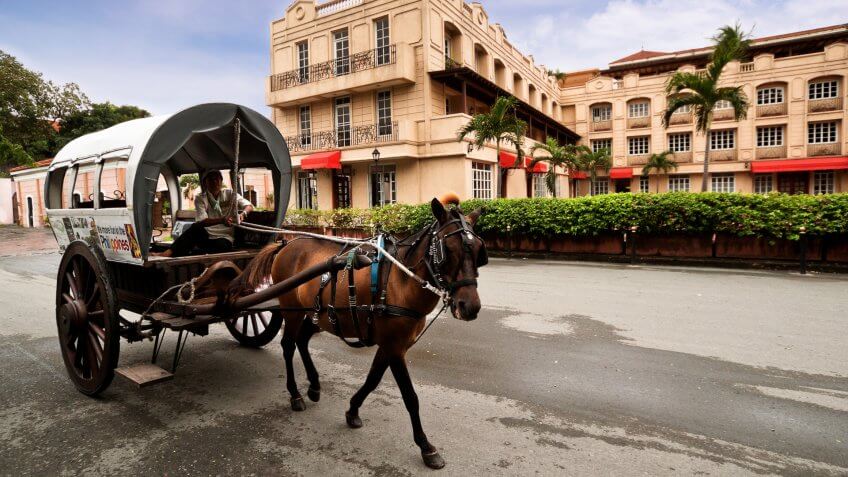 2012 Manila Philippines. Intramuros is the oldest district and h, How Much to Tip When Traveling to These 25 Countries, MANILA, PHILIPPINE -MAY2:A horse drawn carriage the most popular forms o