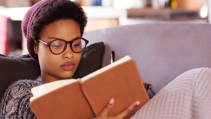 young woman reading a book