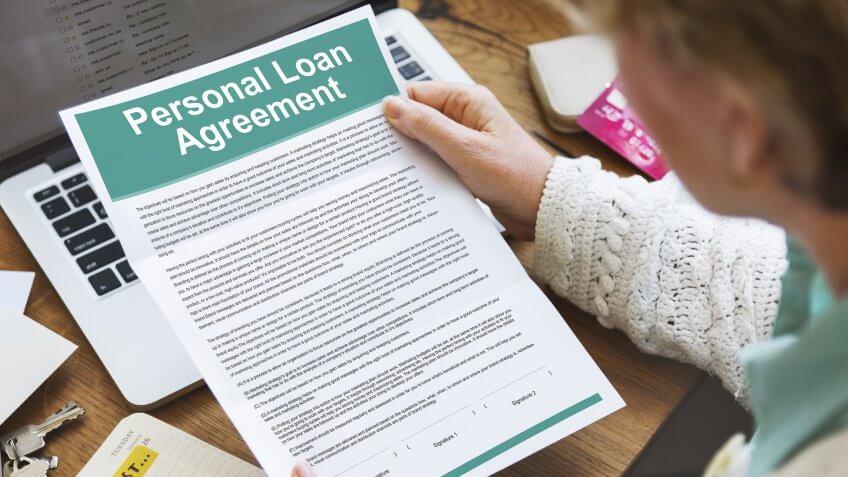 woman holding personal loan agreement