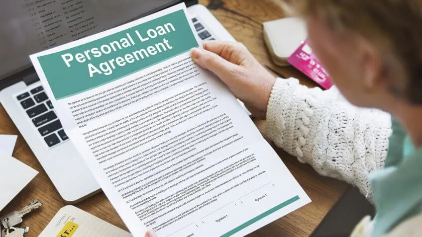 woman holding personal loan agreement