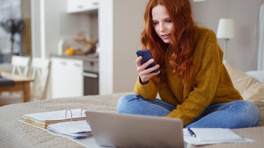 Young woman telecommuting from home
