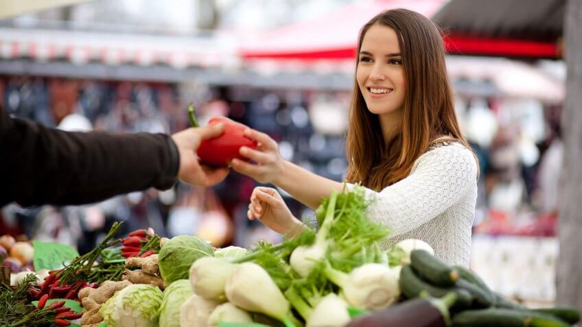 woman shopping at a farmers market