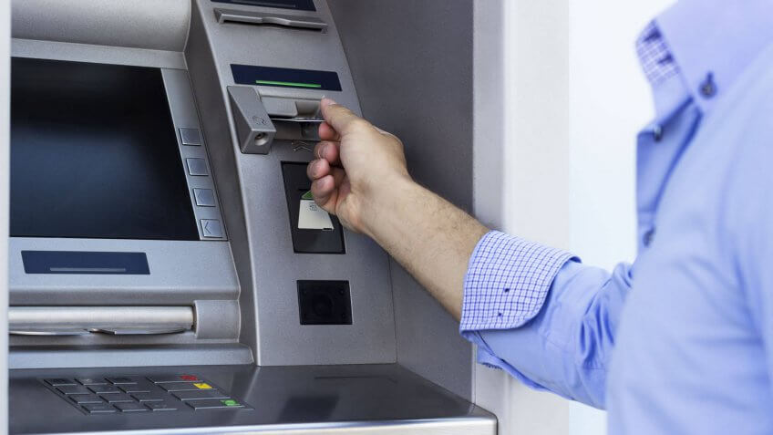 man using an ATM