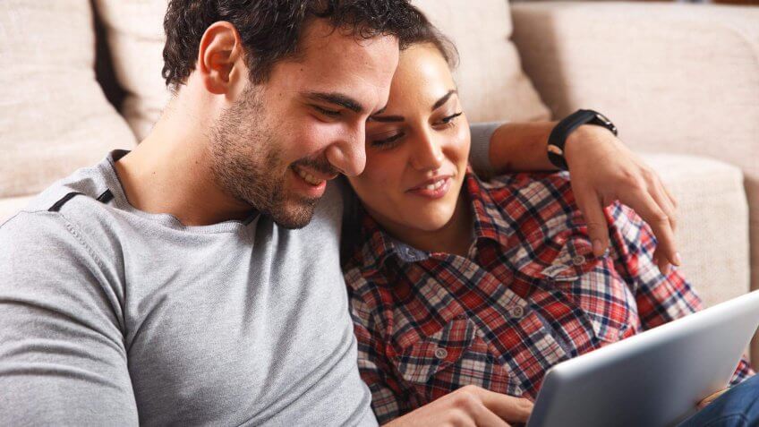 couple looking at a tablet screen