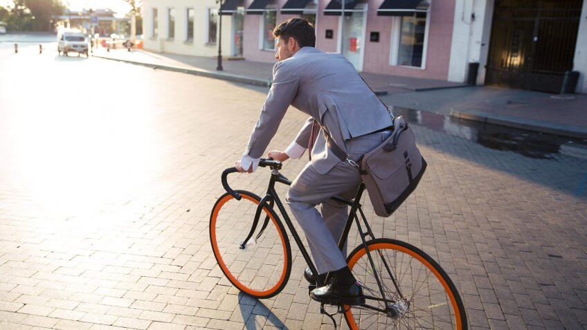 businessman biking to work