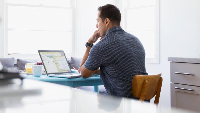 30-34 years, 30-34 years, access, breakfast nook, brunette, candid, casual, c, Candid, Casual, Concentration, Convenience, Domestic Kitchen, E-Mail, Hand On Chin, Internet, Latin American and Hispanic Ethnicity, Mobility, One Person, Real People, Rear View, Table, Technology, Things to Know About High-Yield CDs, Working, access, breakfast nook, brunette, california, color image, communication, connection, copy space, day, domestic life, emailing, focus on background, focusing, horizontal, indoors, laptop, leisure activity, lifestyle, looking down, los angeles, man, mid adult, mid adult men, morning, online, people, photography, reading, serious, sitting, telecommuting, united states, using laptop, viewing, waist up, watching, wireless technology, working from home