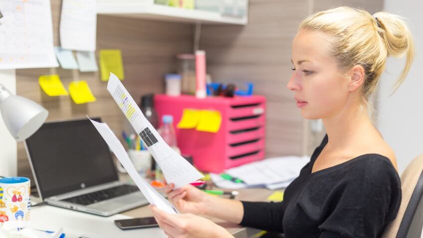 woman-reviewing-papers
