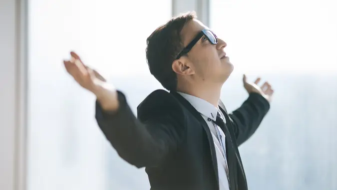 businessman raised hands.