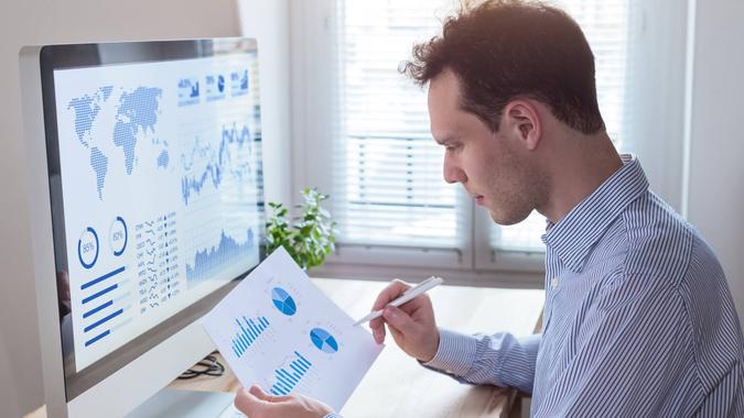 Man studying stock charts