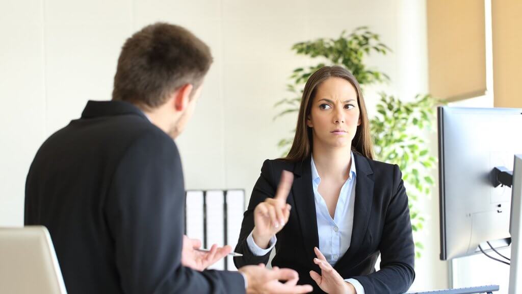 Bill Gates and Warren Buffet say you should learn how to say "No." displeased businesswoman shaking finger at businessman