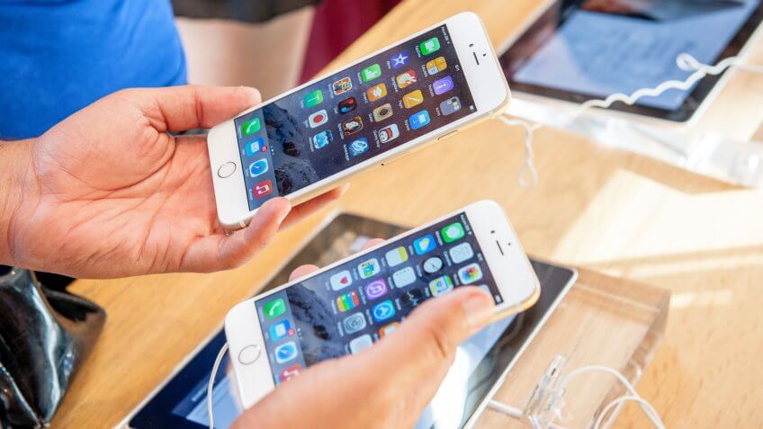 two people comparing iphones