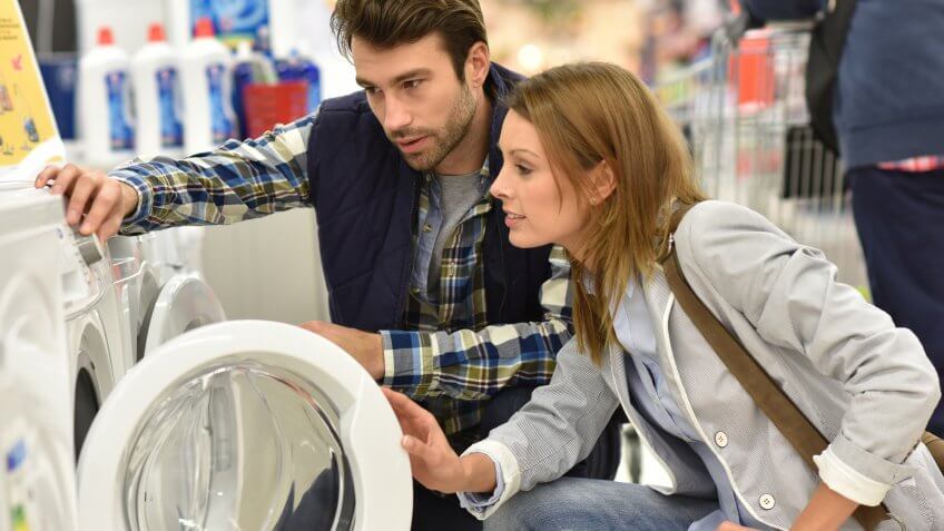 couple buying washing machine