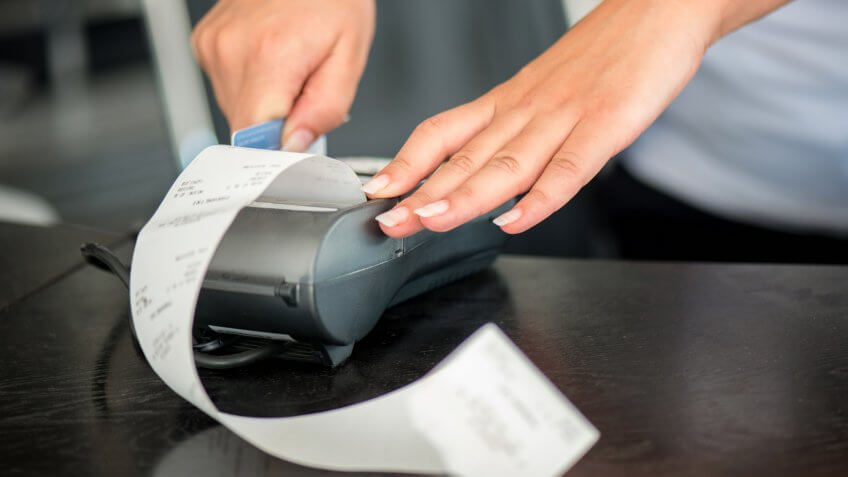 hands typing out receipt