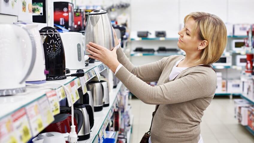 woman shopping for water boiler
