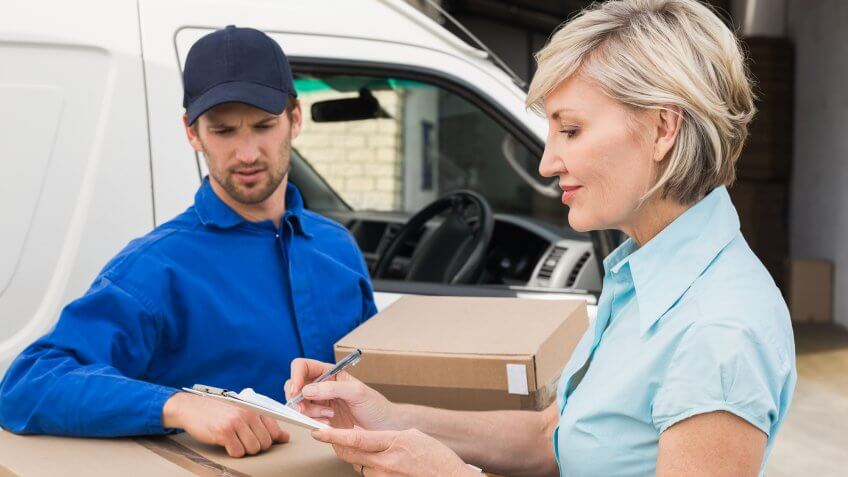woman signing for packages
