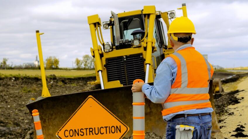 construction workers with machinery