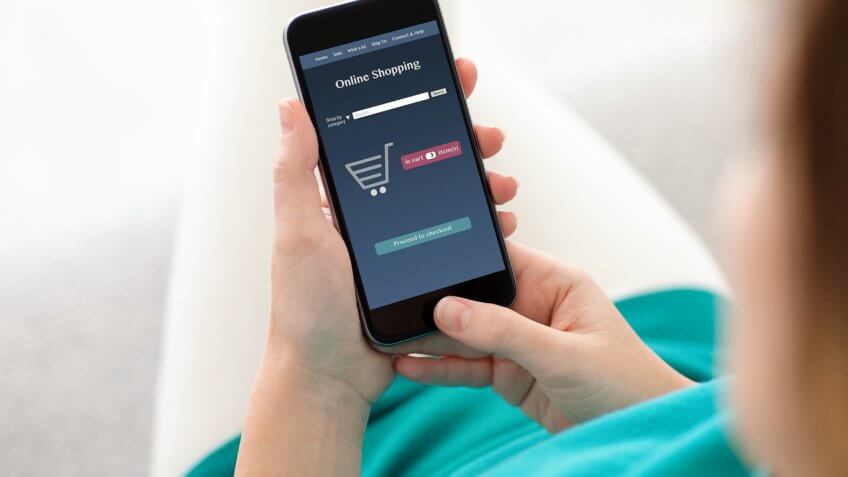 woman shopping online through her phone woman shopping online through her phone