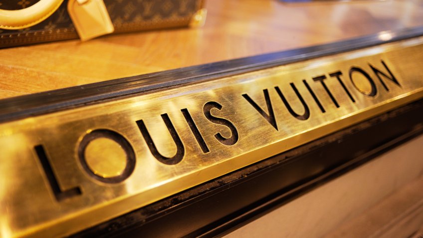 Florence, Italy - June 28, 2011: Louis Vuitton banner under one of it's store window displays in the centre of Florence, Italy.