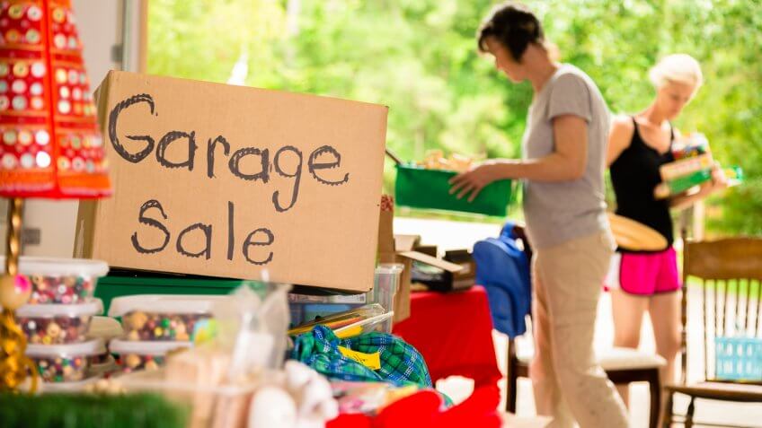 Adult women shopping at a garage sale in suburbs Adult women shopping at a garage sale in suburbs