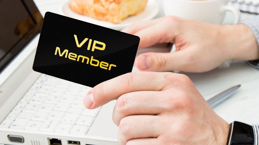 person holding vip member card person holding vip member card