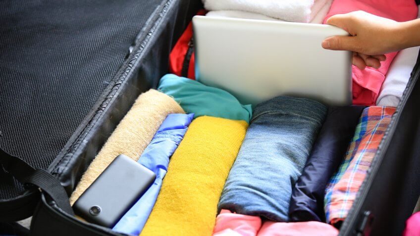 Suitcase packed with clothes Suitcase packed with clothes