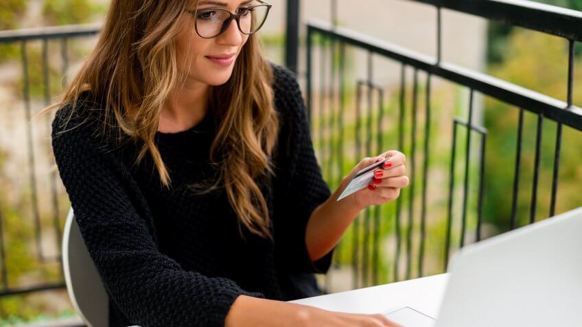 Young woman making online payment Young woman making online payment