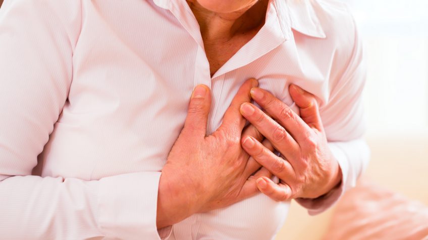 older woman suffering from a heart attack