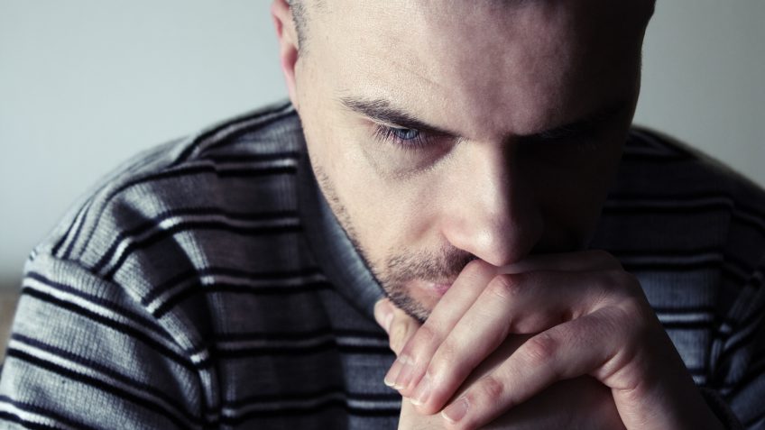 man suffering from mental illness